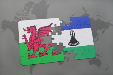 lesotho ve Galler Ulusal bayrak bir dünya haritası üzerinde ile bulmaca