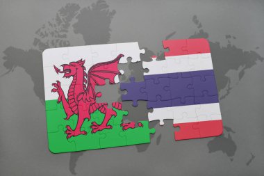 Galler ve Tayland ulusal bayrak bir dünya haritası üzerinde ile bulmaca