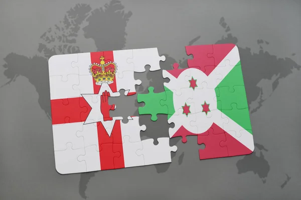 Puzzle con la bandiera nazionale dell'Irlanda del Nord e del Burundi su una mappa del mondo — Foto Stock