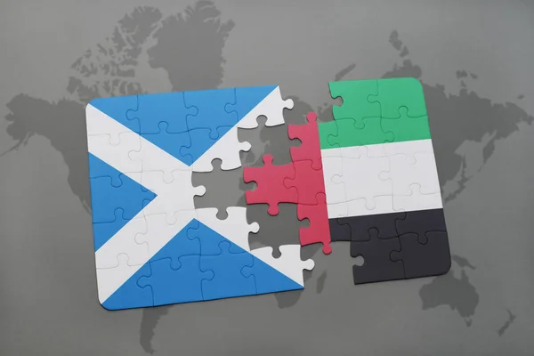 puzzle with the national flag of scotland and united arab emirates on a world map