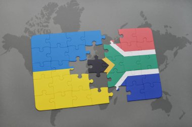 Ukrayna ve Güney Afrika ulusal bayrak bir dünya haritası üzerinde ile bulmaca