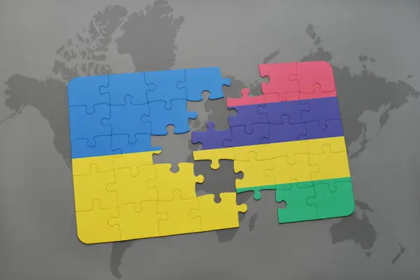 Puzzle con la bandiera nazionale di Ucraina e Mauritius su una mappa del mondo — Foto Stock