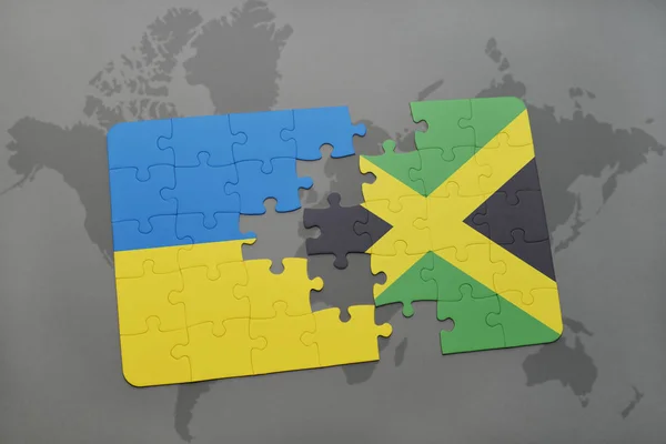 Головоломка з національним прапором України та Ямайки на карті світу — стокове фото