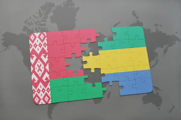 Puzzel met de nationale vlag van Wit-Rusland en gabon op een wereldkaart — Stockfoto