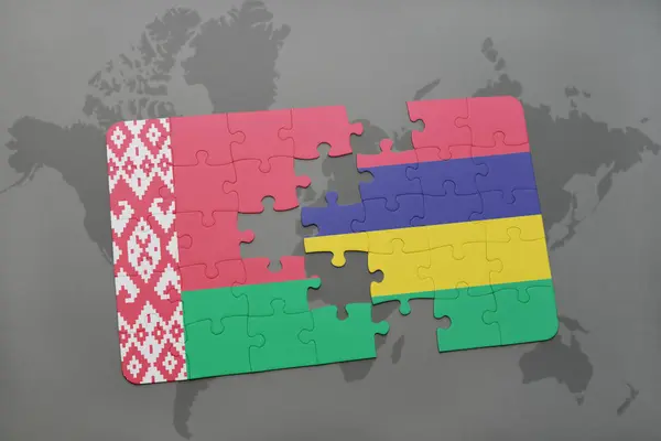 Puzzel met de nationale vlag van Wit-Rusland en mauritius op een wereldkaart — Stockfoto