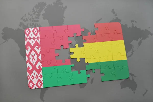 Puzzel met de nationale vlag van Wit-Rusland en bolivia op een wereldkaart — Stockfoto