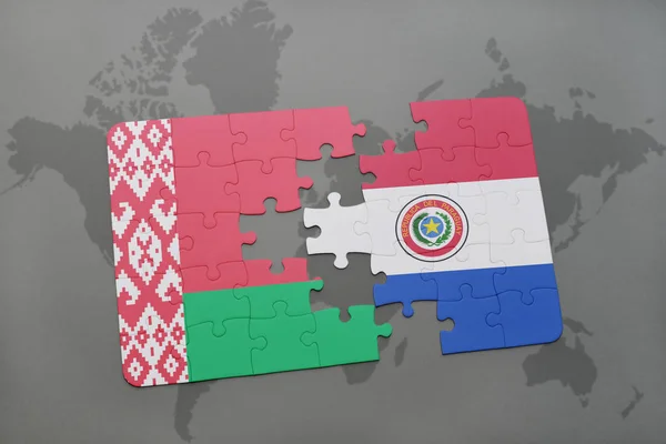 Rompecabezas con la bandera nacional de belarus y paraguay en un mapa del mundo —  Fotos de Stock