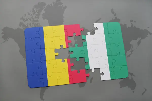 Puzzle with the national flag of romania and nigeria on a world map — Stock Photo, Image