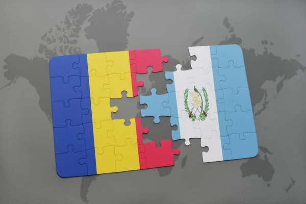 puzzle with the national flag of romania and guatemala on a world map