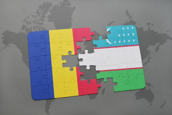 Puzzle con la bandiera nazionale di Romania e uzbekistan su una mappa del mondo — Foto Stock