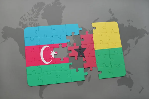Bulmaca ile ulusal bayrak Azerbaycan ve Gine bissau bir dünya haritası üzerinde — Stok fotoğraf