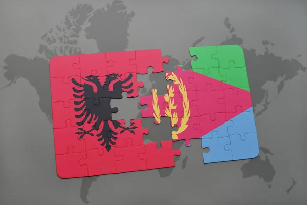 Puzzel met de nationale vlag van Albanië en eritrea op een wereldkaart — Stockfoto