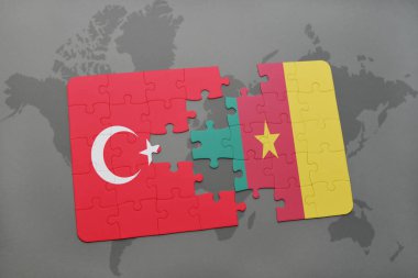 Türkiye ve Kamerun ulusal bayrak bir dünya haritası üzerinde ile bulmaca