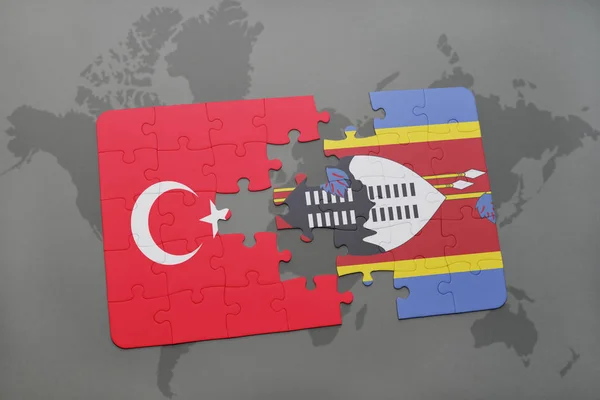 Türkiye ve Svaziland ulusal bayrak bir dünya haritası üzerinde ile bulmaca — Stok fotoğraf