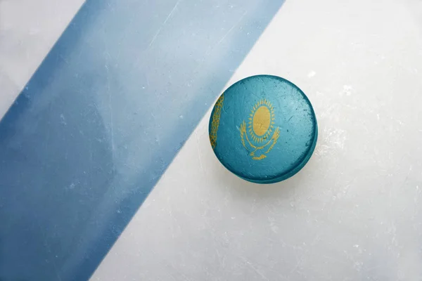 Old hockey puck with the national flag of kazakhstan. — Stock Photo, Image