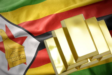 Zimbabve bayrağı üzerinde parlayan altın bullions