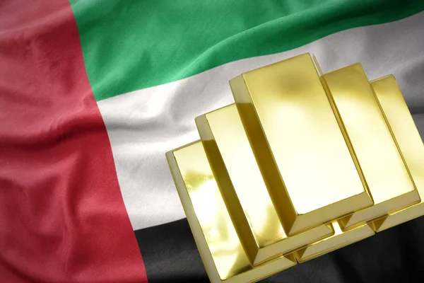 Shining golden bullions on the united arab emirates flag — Stock Photo, Image