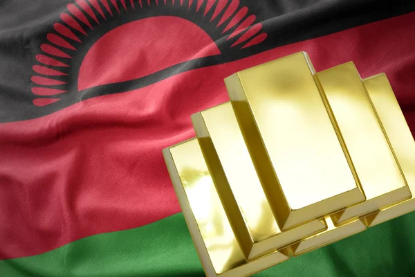Brillanti lingotti d'oro sulla bandiera del Malawi — Foto Stock