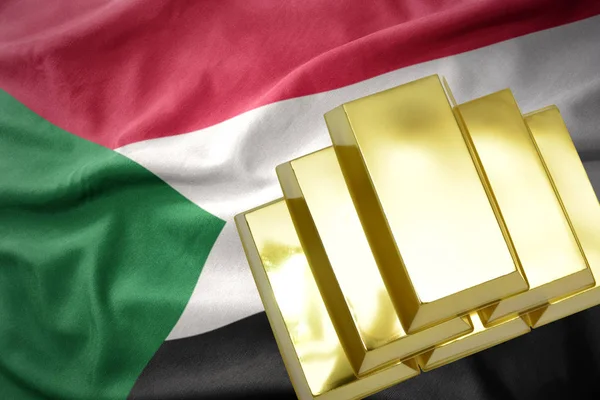 Brillantes lingotes dorados en la bandera de Sudán —  Fotos de Stock