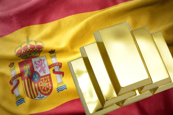 Zářící zlatou bullions na vlajce Španělsko — Stock fotografie