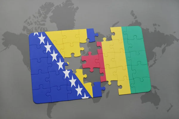 Rompecabezas con la bandera nacional de Bosnia y Herzegovina y Guinea en un mapa del mundo — Foto de Stock