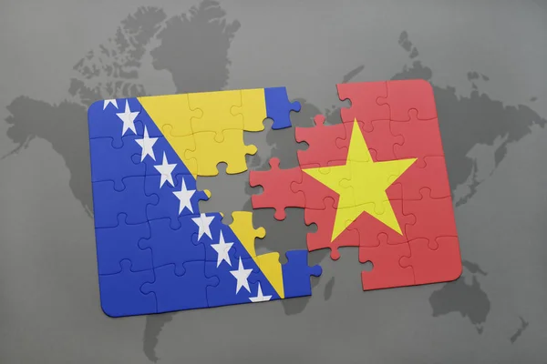 Головоломка з Національний прапор Боснії та Герцеговини і В'єтнам на карті світу — стокове фото