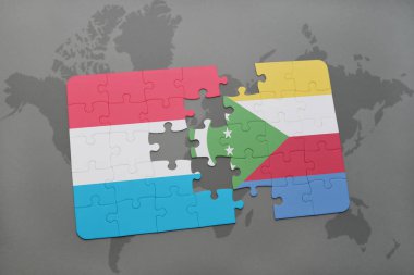Lüksemburg ve Komor Adaları ulusal bayrak bir dünya haritası üzerinde ile bulmaca