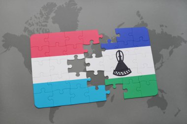 bir dünya haritası üzerinde Lüksemburg ve Lesoto bayrağı ulusal ile bulmaca