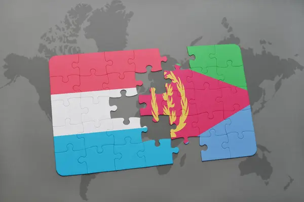 Puzzle z Flaga narodowa Luksemburga i Erytrei na mapie świata — Zdjęcie stockowe