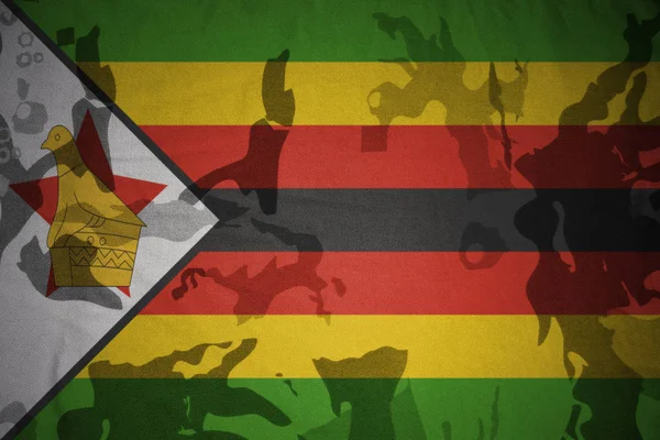 Flag of zimbabwe on the khaki texture . military concept — Stock Photo, Image
