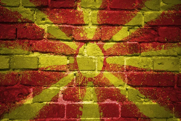 Painted national flag of macedonia on a brick wall — Stock Photo, Image