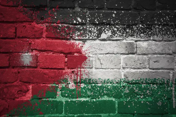 Jordánia zászlaja a tégla falon festett — Stock Fotó