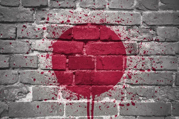 Painted national flag of japan on a brick wall — Stock Photo, Image