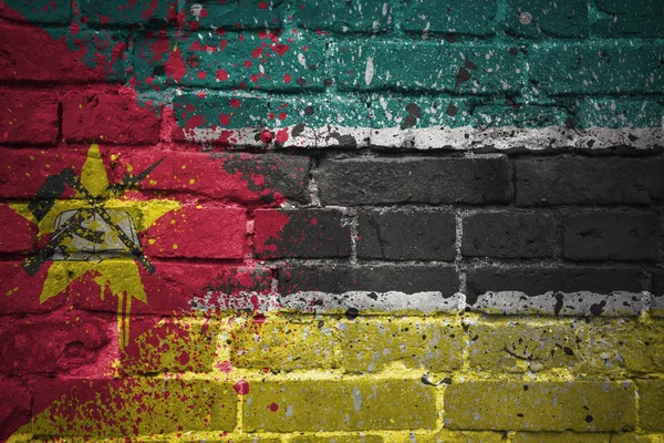 Painted national flag of mozambique on a brick wall — Stock Photo, Image