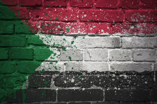 Bandiera nazionale dipinta di sudan su un muro di mattoni — Foto Stock