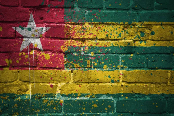 Painted national flag of togo on a brick wall — Stock Photo, Image