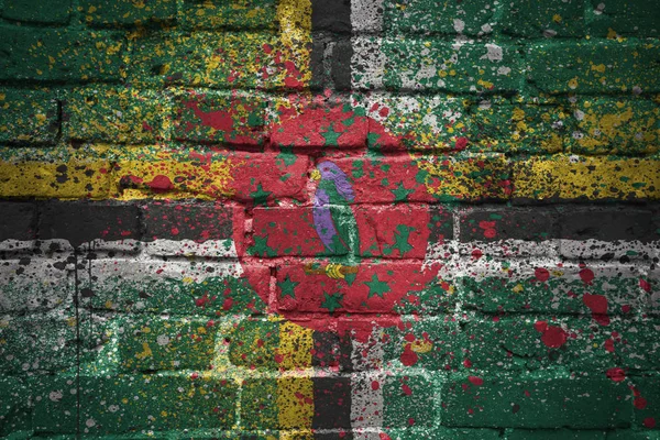Painted national flag of dominica on a brick wall — Stock Photo, Image