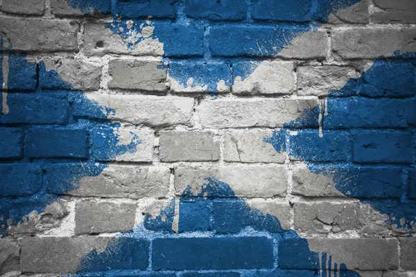 Nationale vlag van Schotland op een bakstenen muur geschilderd — Stockfoto