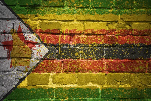 Painted national flag of zimbabwe on a brick wall — Stock Photo, Image