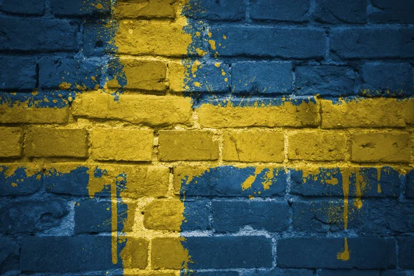 Painted national flag of sweden on a brick wall — Stock Photo, Image