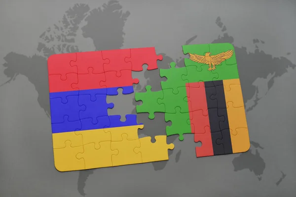 Puzzle avec le drapeau national de l'arménie et de la zambie sur une carte du monde — Photo