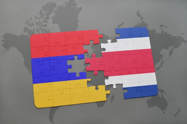 Головоломка з національним прапором Арменії та Квебеку на карті світу — стокове фото