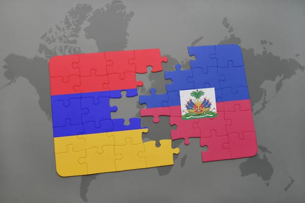 Ermenistan ve haiti ulusal bayrak bir dünya haritası üzerinde ile bulmaca — Stok fotoğraf