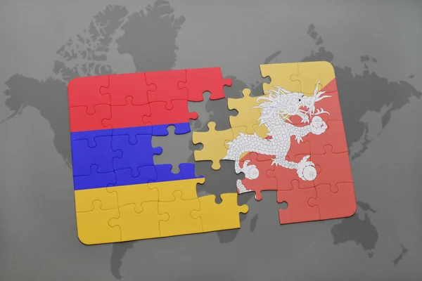 益智与亚美尼亚和不丹国旗在世界地图上 — 图库照片