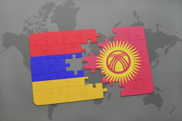 益智与亚美尼亚和吉尔吉斯斯坦国旗在世界地图上 — 图库照片