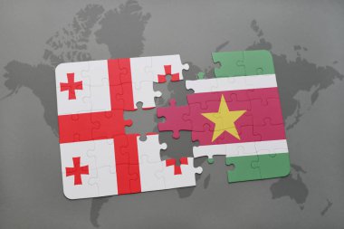 Gürcistan ve Surinam ulusal bayrak bir dünya haritası üzerinde ile bulmaca