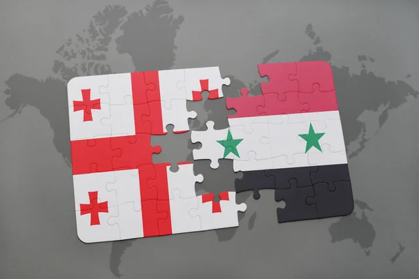 Puzzel met de nationale vlag van Georgië en Syrië op een wereldkaart — Stockfoto