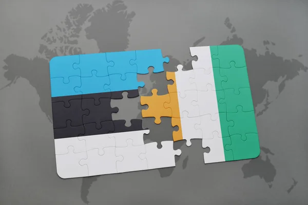 Puzzel met de nationale vlag van Estland en cote divoire op een wereldkaart — Stockfoto