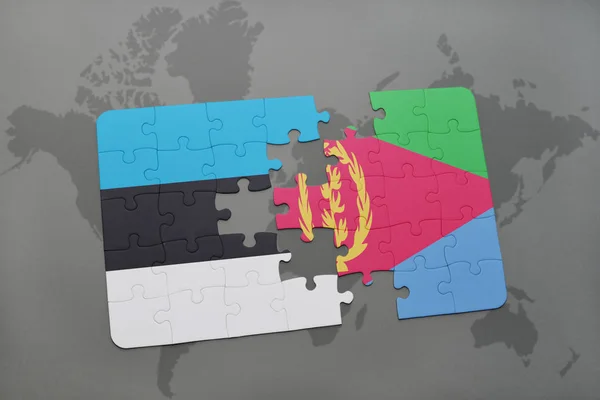 Puzzle avec le drapeau national de l'estonie et de l'eritrea sur une carte du monde — Photo