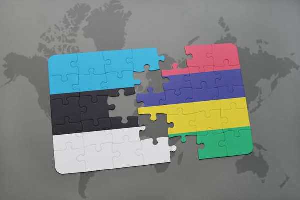 Puzzle with the national flag of estonia and mauritius on a world map — Stock Photo, Image